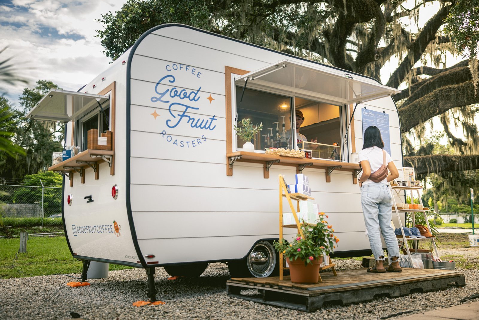 Good Fruit's vintage coffee trailer under live oaks in Tampa
